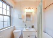 Thumbnail 15 of 25 - a bathroom with a sink toilet and a shower