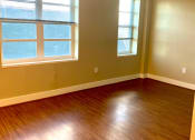 Thumbnail 9 of 18 - vacant livinga area with ceiling and large windows at 310 Pennsylvania apartments in Washington dc