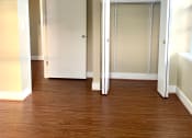 Thumbnail 10 of 18 - vacant living bedroom with large closet and hardwood flooring in 3101 pennsylvania apartments in washinton dc