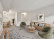Thumbnail 3 of 43 - A living room with a green armchair and a brown sofa.