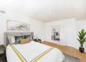 Thumbnail 9 of 14 - bedroom with bed, nightstand, and closet at jasper place apartments in washington dc