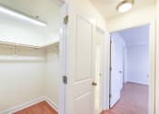 Thumbnail 11 of 14 - hallway view of closet and bedroom with wood flooring at jasper place apartments in congress heights washington dc