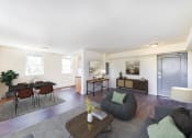 Thumbnail 4 of 18 - a living room aom with a couch and a table at 734 longfellow tax credit apartments in washington dc