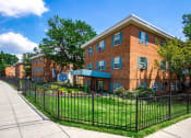 Thumbnail 12 of 15 - exterior brick view of manor village  tax credit apartments in washington dc