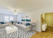 Thumbnail 6 of 33 - living area with sofa, coffee table, ceiling fan and view of foyer at  meridian park apartments in washington dc
