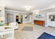 Thumbnail 21 of 33 - lobby lounge with social seating and modern artwork at the meridian park apartments in columbia heights washington dc