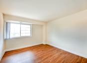 Thumbnail 8 of 24 - bedroom with window and wood flooring at naylor overlook apartments in skyland washington dc