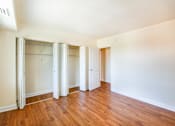 Thumbnail 7 of 24 - bedroom with large closets and hardwood flooring at naylor overlook apartments in skyland washington dc
