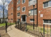 Thumbnail 14 of 15 - exterior of brick apartment building at new horizon apartments in washington dc