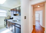 Thumbnail 3 of 15 - hallway view of kitchen at new horizon apartments in washington dc