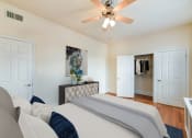Thumbnail 3 of 28 - bedroom with bed, dresser, large closet, ceiling fan and hardwood floors at the norwood apartments in adams morgan washington dc