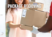 Thumbnail 23 of 23 - Two people exchanging a package with the label "PACKAGE RECEIVING" visible.