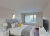 Thumbnail 7 of 13 - a bedroom with a bed and a window at penn view apartments in washington dc