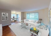 Thumbnail 6 of 13 - a living room with a white couch and a table at penn view apartments in washington dc