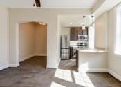 Thumbnail 3 of 28 - kitchen with espresso cabinetry, breakfast bar and stainless steel appliances at petworth station apartments in washington dc
