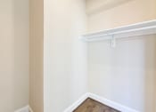 Thumbnail 12 of 28 - large walk in closet with shelving at petworth station apartments in washington dc