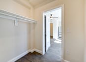 Thumbnail 13 of 28 - walk in closet with large shelf and wood flooring at petworth station apartments in washington dc