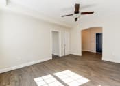 Thumbnail 4 of 28 - vacant living area with wood flooring and ceiling fan at petworth station apartments in washington dc
