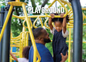 Thumbnail 20 of 20 - A child is climbing on a playground structure with the word "PLAYGROUND" written on it.