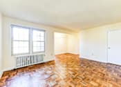 Thumbnail 11 of 22 - vacant living area with hardwood flooring and large windows at richman apartments in washington dc