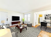 Thumbnail 5 of 22 - living area with sofa, coffee table, windows and view of dining area at the richman apartments in congress heights washington dc