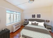 Thumbnail 9 of 20 - Bedroom with bed, nightstands, and large windows at sherry Hall apartments in washington dc