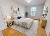 Thumbnail 6 of 17 - A bedroom with a bed, nightstands, and a rug.