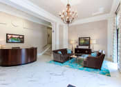 Thumbnail 19 of 25 - a lobby with couches, a table and a chandelier at the calverton apartment building in adams morgan washington dc