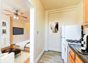 Thumbnail 4 of 22 - kitchen with gas range, wood cabinetry and energy efficient appliances at the foreland apartments in washinton dc