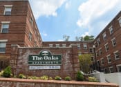 Thumbnail 13 of 14 - brick exterior of the oaks apartments in washington dc