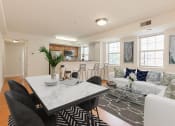 Thumbnail 7 of 14 - open layout showing living area, dining area and kitchen at the oaks apartments in washington dc