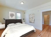 Thumbnail 9 of 39 - Bedroom with bed, nightstands, and large closet  at twin oaks apartments columbia heights washington dc