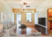 Thumbnail 1 of 39 - living area with large windows, sofa, coffee table, hardwood floors and view of kitchen at at twin oaks columbia heights washington dc