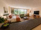 Thumbnail 3 of 36 - A modern living room with a large window and a grey counter.