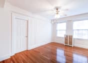 Thumbnail 13 of 28 - living area with hardwood floors and ceiling fan at wakefield hall apartments in u street washington dc