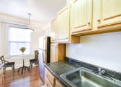 Thumbnail 2 of 28 - kitchen with view of dining area at wakefield hall apartments in washington dc