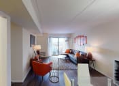 Thumbnail 9 of 27 - Livingroom with sofa, coffee table, decorative rug and view of balcony at washington view apartments in southeast dc