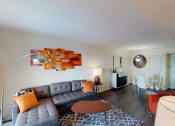 Thumbnail 4 of 27 - Livingroom with sofa, coffee table, decorative rug and view of dining area