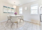 Thumbnail 6 of 14 - dining area with table, chairs, windows and tile flooring at sheridan station south townhomes in washington dc