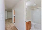 Thumbnail 14 of 17 - hallway view of kitchen and bathroom at whitelaw apartments in washington dc