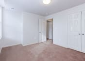 Thumbnail 12 of 17 - vacant bedroom with plush carpeting, windows and closet at whitelaw apartments in washington dc