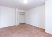 Thumbnail 13 of 17 - vacant bedroom with plush carpeting, windows and closet at whitelaw apartments in washington dc