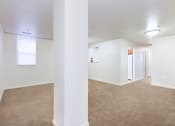 Thumbnail 8 of 17 - vacant living area with plush carpeting, windows and view of kitchen at whitelaw apartments in washington dc