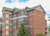 Thumbnail 2 of 29 - a picture of a large apartment building