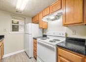 Thumbnail 7 of 23 - Fully Furnished Kitchen at Bradford Gwinnett Apartments, Georgia