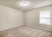 Thumbnail 3 of 23 - Carpeted Bedroom at Bradford Gwinnett Apartments, Norcross, GA