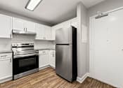 Thumbnail 9 of 35 - Upgraded kitchen with stainless steel appliances at Crogman School Lofts, Atlanta GA 30315
