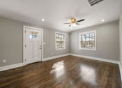 Thumbnail 3 of 29 - Living room with ceiling fan and light at Balfour Marietta Apartments, Marietta, GA