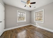 Thumbnail 12 of 29 - A bedroom with a bed, a ceiling fan and window at Balfour Marietta Apartments, Marietta, GA