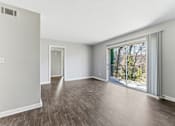Thumbnail 29 of 51 - Room with sliding glass door and wooden floor at The Reserve at Brookhaven, Atlanta, GA, 30329